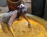 A woman at Akinlapa oil farm filters the fresh palm fruits. Abiodun Jamiu