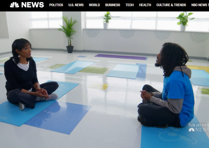 Interviewer and yoga instructor in yoga studio
