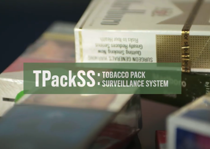 Tobacco Pack Surveillance System logo with cigarette packs in the background