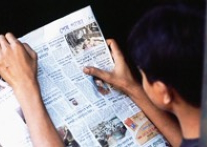 person reading newspaper