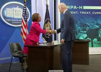 Lisa Cooper shakes hands with President Biden